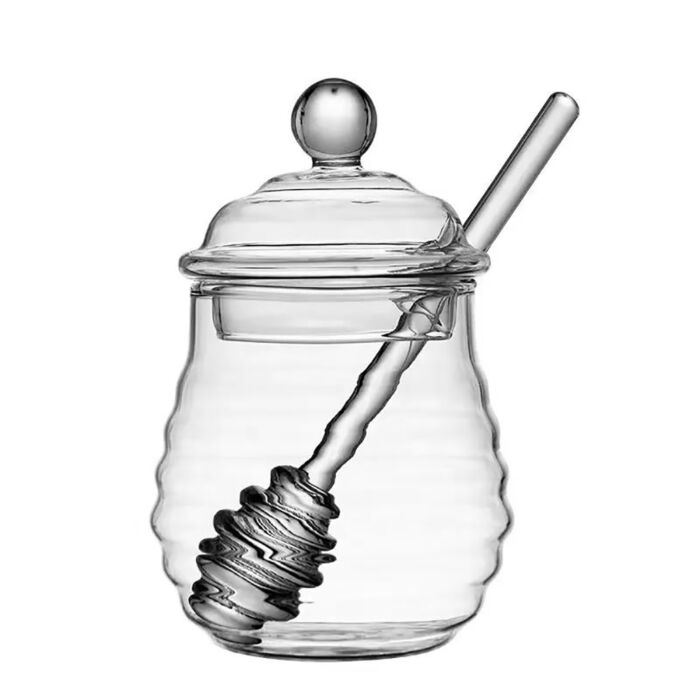 A Honey Jar with a Spoon for Honey Nuts Almonds Stock Image - Image of  background, drop: 106554251